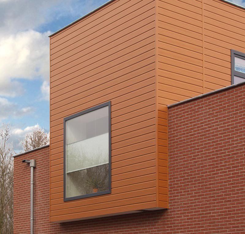 Teilfassade mit Keralit Paneele in der Farbe california redwood.